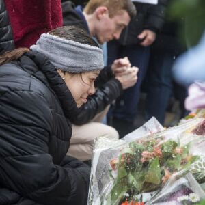 The family of Vicente Juarez, one of five people killed in a mass shooting at the Henry Pratt Company in Aurora, joins hundreds of mourners to pay their respects at a prayer vigil at the company, Sunday afternoon, Feb. 17, 2019. | Ashlee Rezin/Sun-Times