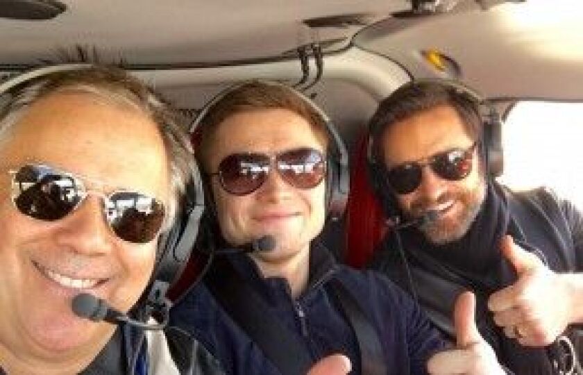 Richard Roeper (from left), Taran Egerton and Hugh Jackman enjoy the ride. | Jesse Goddard/For the Sun-Times