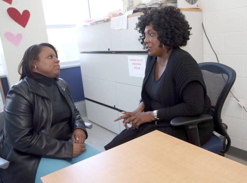 Charisma Pryor (left) met Lisa Butler, both licensed social workers, at a support group meeting. | Kevin Tanaka/For the Sun Times