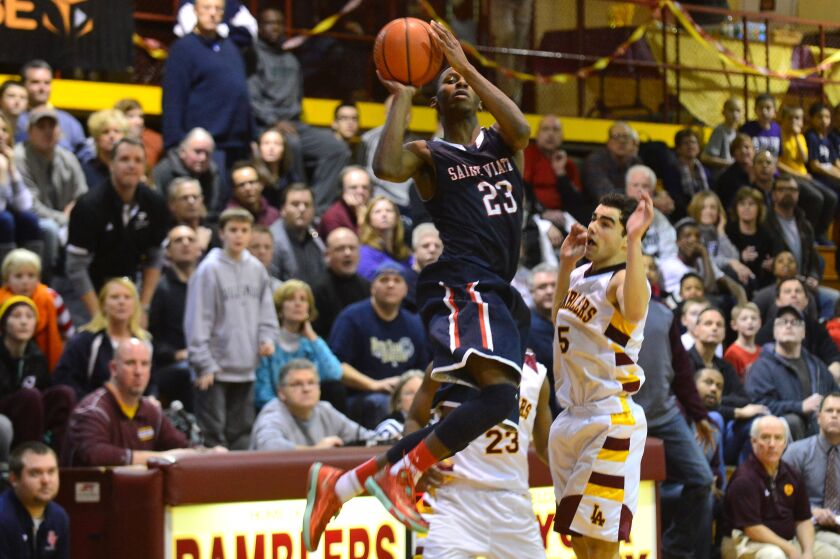 St. Viator’s Ore Arogundade fires a difficult three at the buzzer for a chance to defeat Loyola.