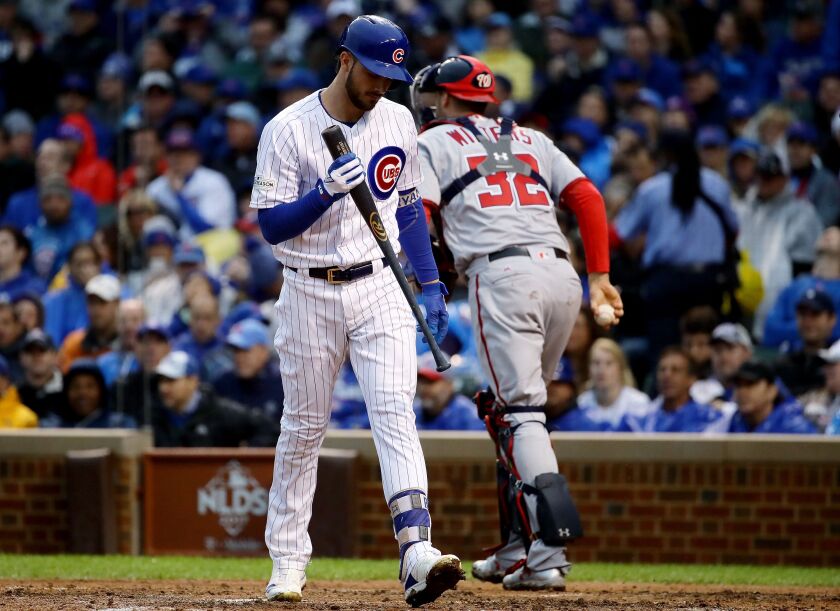 <em>Kris Bryant walks to the dugout after striking out. (Getty Images)</em>