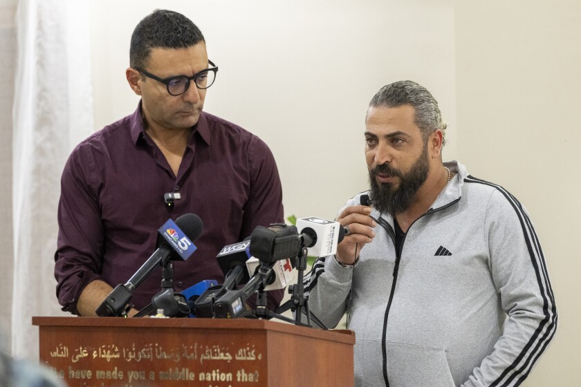 Wadee Alfayoumi’s father Odai Alfayoumi, right, speaks during a one year remembrance and prayer service for his son who was fatally stabbed last year, at the Muslim Community Center in Irving Park, Monday, Oct. 14, 2024.