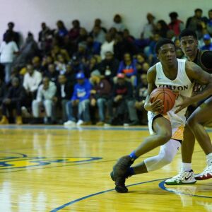 Simeon’s Kejuan Clements (0) slips past Morgan Park’s Adam Miller (44), Thursday 01-24-19. Worsom Robinson/For the Sun-Times.