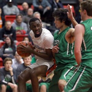 Whitney Young’s Keenan Jones (3) tries to get around York’s Hassan Iqbal (33) in Hillside, Wednesday, March 6, 2019. | Kevin Tanaka/For the Sun Times