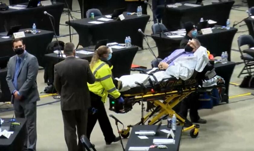 Rep. Darren Bailey, R-Xenia, is wheeled out of the Bank of Springfield Center Sunday afternoon after experiencing a medical emergency.