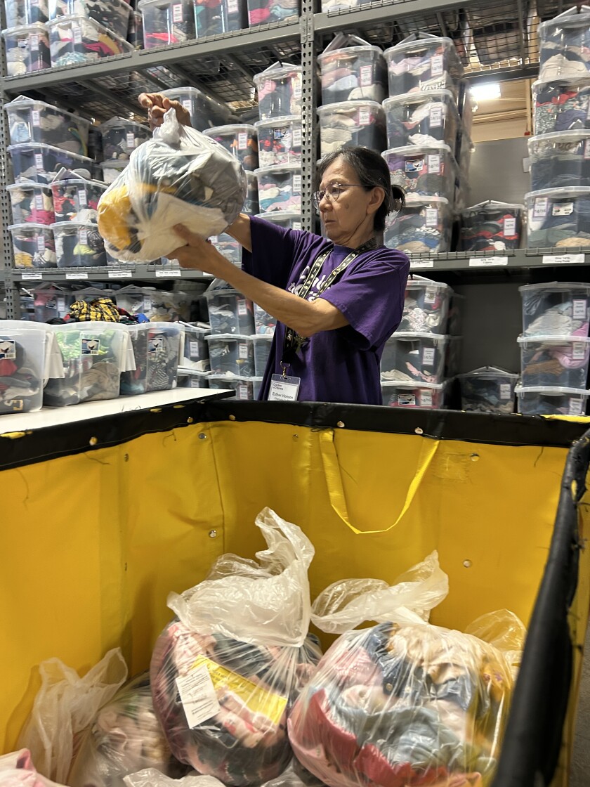 Esther Honson volunteering at Cradles to Crayons