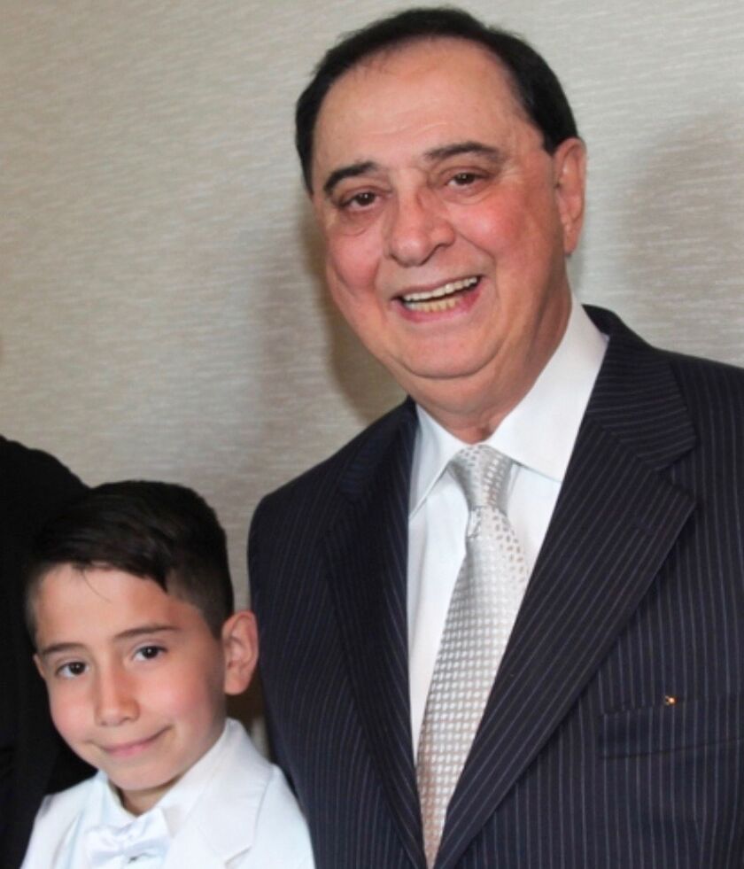 Luis (right) and son Bryan Rossi.