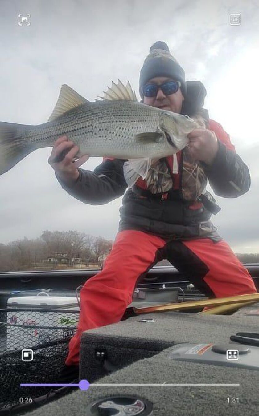 Dustin Perkins with a good striper in northern Illinois. Provided photo