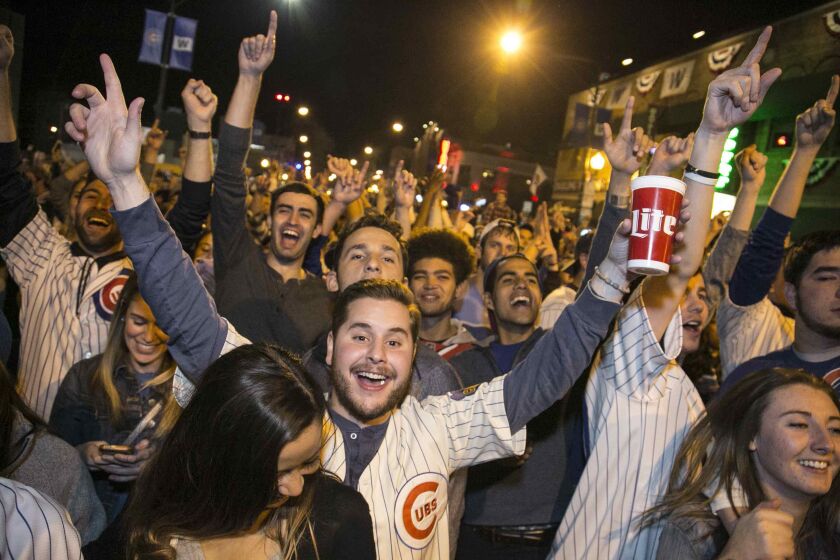 Cubs fans celebrate outside Wrigley Field. | Ashlee Rezin / Sun-Times