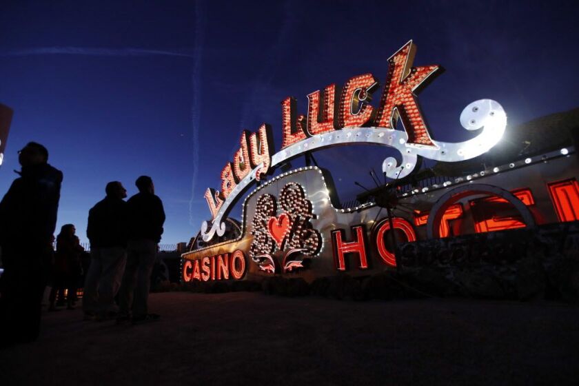 Projectors light up non-working neon signs at an exhibit at the Neon Museum in Las Vegas. Starting this week, visitors will be able to see many of the city’s classic neon signs just like they were decades ago through a type of augmented reality that proje
