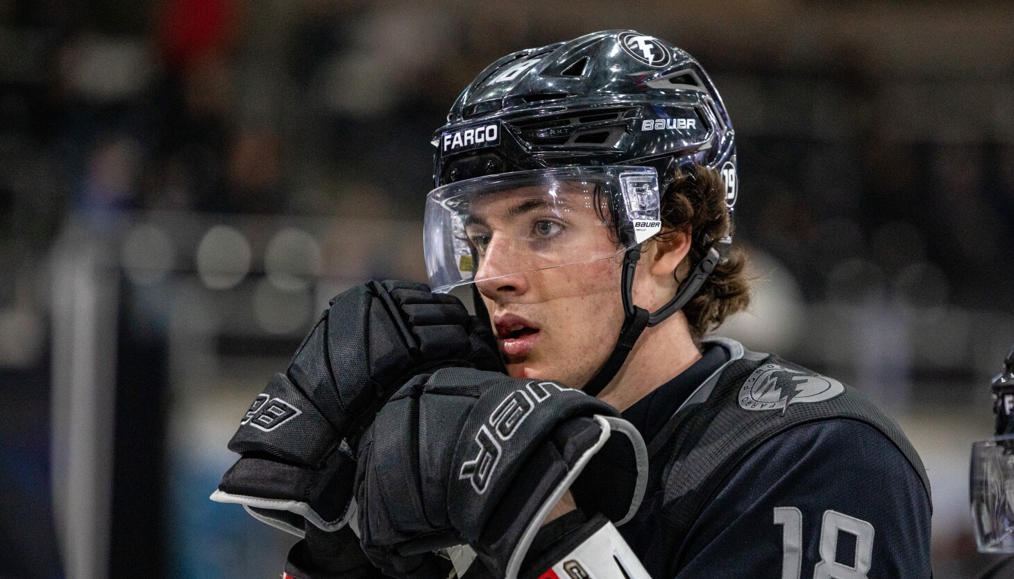 Blackhawks prospect Mason West plays hockey with quarterback's