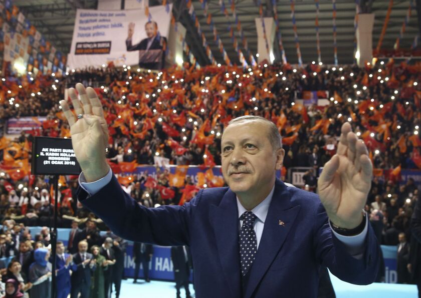 Turkey’s President Recep Tayyip Erdogan salutes as he addresses his ruling party members in Bursa, Turkey, on Sunday. | AP Photo