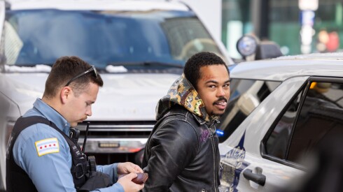 Chicago rapper Adamn Killa is handcuffed while attempting to film a TikTok at E. Randolph St. and N. Michigan Ave. downtown, Monday, Nov. 10, 2025. He has recently gone viral for videos of him approaching police and National Guard members and saying "arrest me, daddy." | Candace Dane Chambers/Sun-Times.