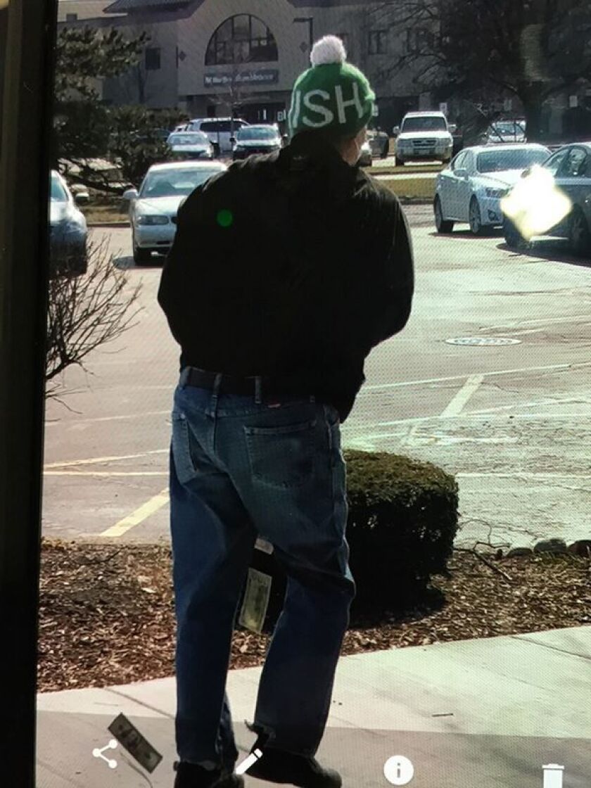 A suspect leaving a Wheaton bank robbery Thursday | Wheaton police