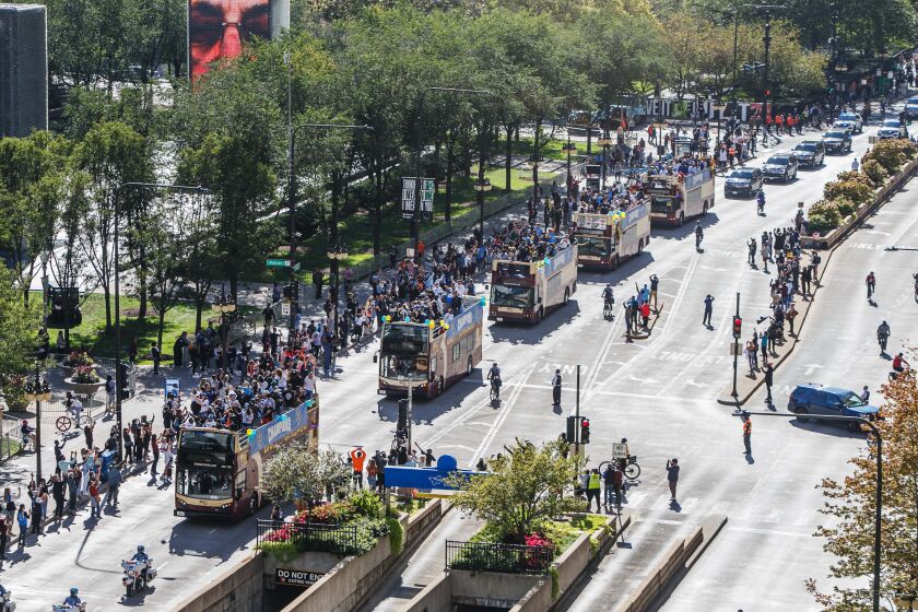 The Chicago Sky buses along Michigan Avenue at Millennium Park for the Chicago Sky Parade Tuesday morning, Oct. 19, 2021.