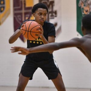 Leo’s Fred Cleveland Jr. holds on to the ball tight. Worsom Robinson/For the Sun-Times.