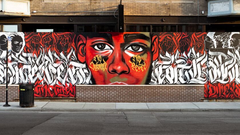 A Black Lives Matter mural painted at Belmont and Francisco avenues by Dwight White II following the George Floyd killing in Minneapolis by a white cop earlier this year.