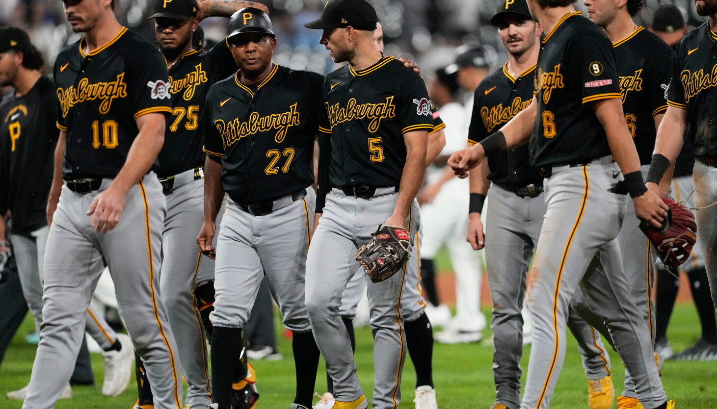Photo: Chicago Sun-Times Brandon Lowe is led off the field by coaches and teammates after Pirates and White Sox benches clear in Wednesday's game