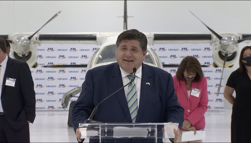 Gov. J.B. Pritzker speaks at the ribbon cutting for a new aviation maintenance training facility in McKinley Park on Wednesday.