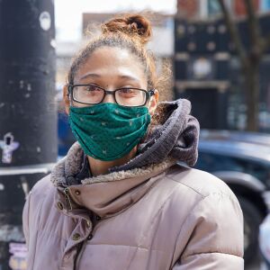 Tera Petty, 32, of Wicker Park, wears a green mask with ducks. “I love the ducks on it. I thought it was cute and different and I love the color with my skin tone.”