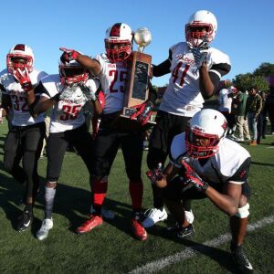 Raby’s Romel Goston (25) celebrates with his teammates. Allen Cunningham/For the Sun-Times.