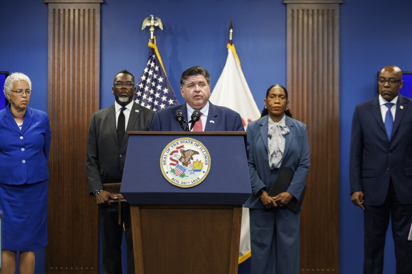 From left to right, Cook County Board President Toni Preckwinkle, Mayor Brandon Johnson, Lieutenant Governor Juliana Stratton and State Attorney Kwame Raoul stand behind Gov. J.B. Pritzker as he speaks about President Trump’s plan to send federal law enforcement to Chicago and neighboring suburbs during a press conference at the State of Illinois administrative offices at 555 W Monroe St in Chicago, Tuesday, Sept. 2, 2025.
