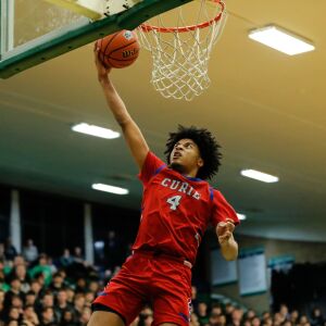 Curie’s Saiveon Williams (4) shoots the ball over Notre Dame.