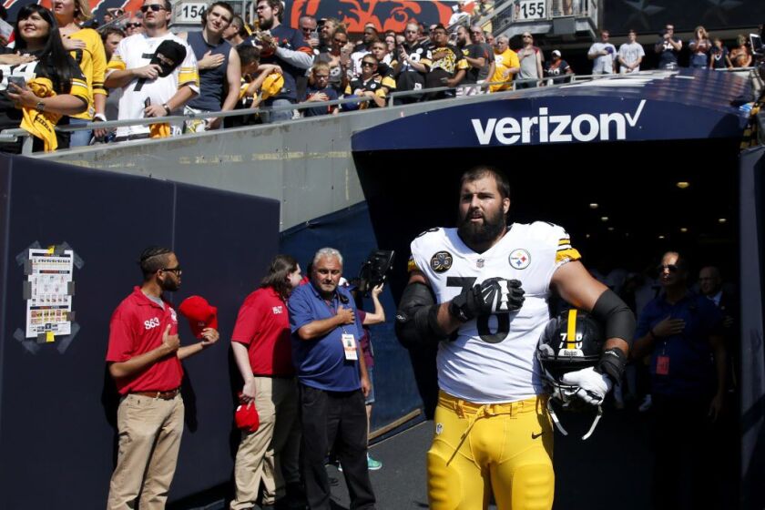 Alejandro Villanueva #78 of the Pittsburgh Steelers stands by himself in the tunnel for the national anthem before the game against the Bears at Soldier Field. (Photo by Joe Robbins/Getty Images)