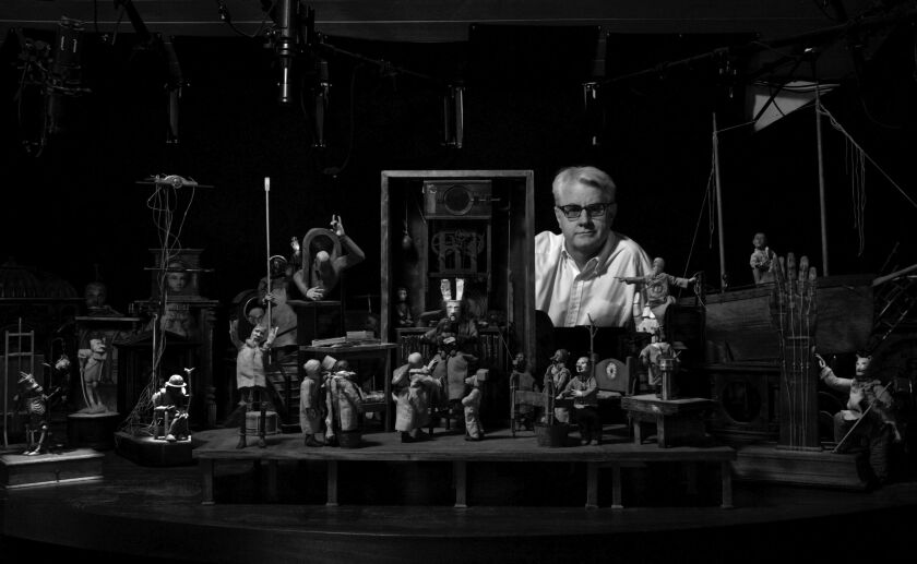 John Frame with his sculptural work for “Poor Tom’s Library.” His work is found in more than 300 public and private collections.<em> | </em>Ashley Fennell