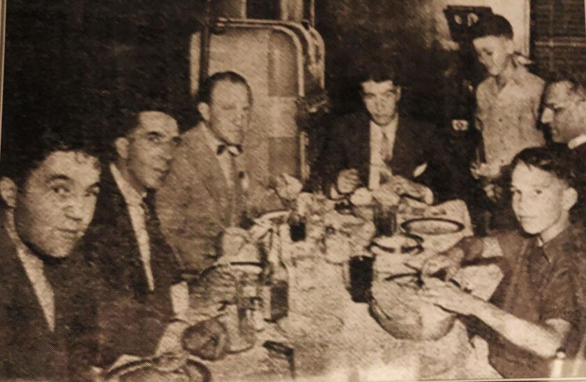 Young Larry Panozzo (front right) enjoys a spaghetti dinner with New York Yankees legend Joe DiMaggio (rear, center) at St. Anthony of Padua parish in the early 1940s. Also present (from left): his uncle Louis Panozzo, then-Ald. Dominic Lupo, Oscar “Ski” Melillo, who played for the St. Louis Browns and Boston Red Sox and (behind Larry) the Rev. Joseph Chiminello.