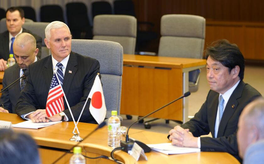 U.S. Vice President Mike Pence, left, looks at Japanese Defense Minister Itsunori Onodera, right, during a meeting at Defense Ministry in Tokyo on Wednesday. | AP photo
