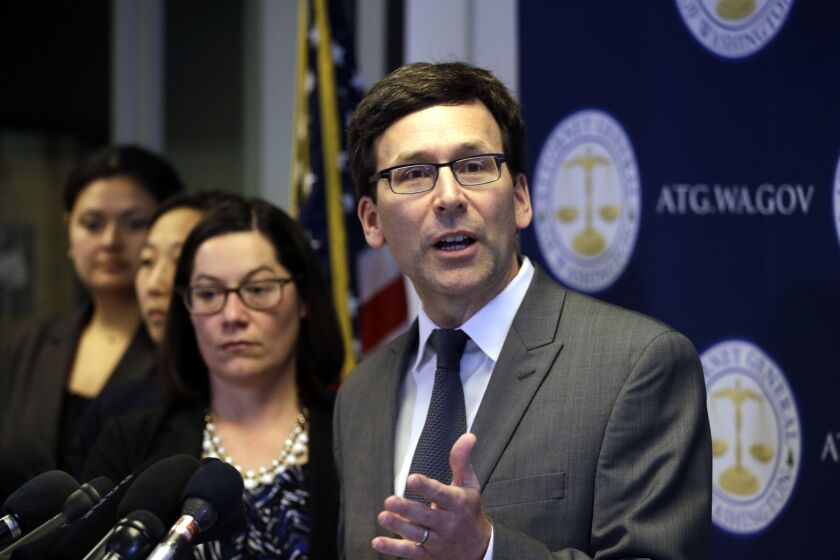 Washington State Attorney General Bob Ferguson speaks at a news conference last week about the state’s response to President Trump’s revised travel ban. Ferguson is pushing for a hearing before Judge James Robart, who halted the original ban last month. F