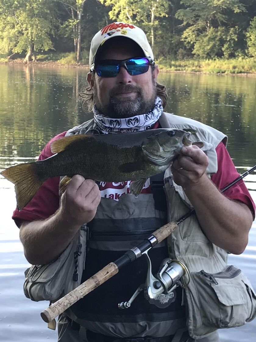 Ken “Husker” O’Malley with a Kankakee River smallmouth bass. Provided photo
