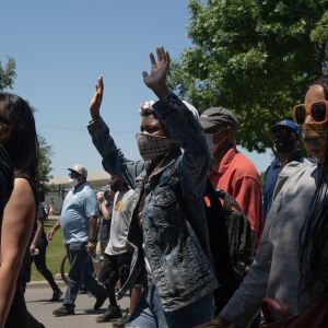 Protesters march down South Independence Boulevard in North Lawndale during the West Side interfaith peace march to demand police reform and equal opportunities for Black Americans on June 12, 2020. Protesters stopped at sites that Dr. Martin Luther King Jr. visited.