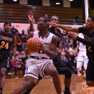 DePaul Prep’s Perry Cowan Jr. (11) drives straight to the basket. Worsom Robinson/For the Sun-Times.