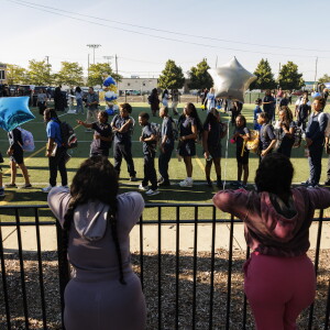 Parents watch as students walk into school Monday on the first day of class at George Leland Elementary School at 512 S. Lavergne Ave. in Austin.