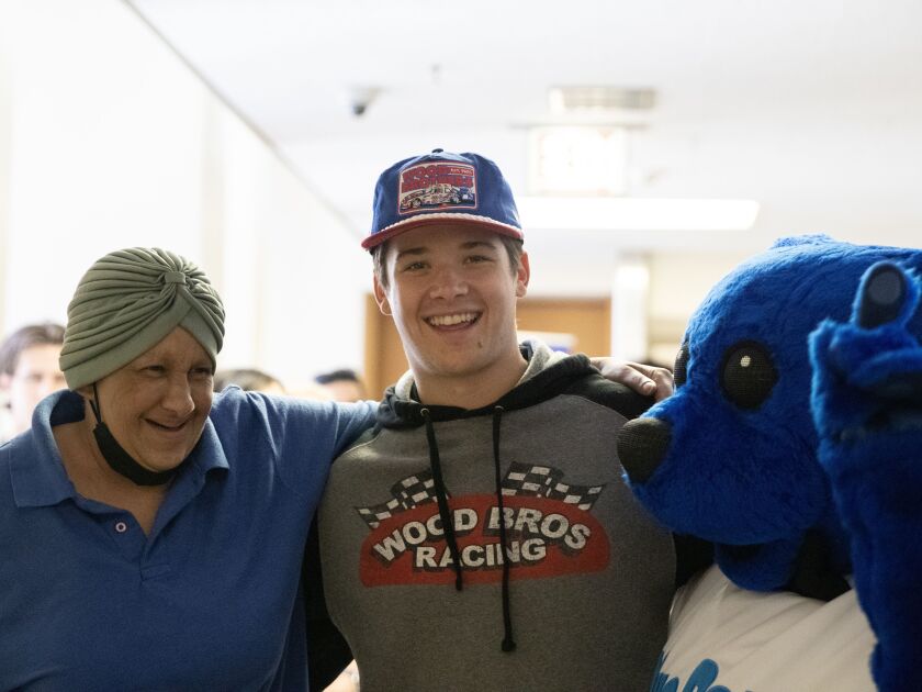 NASCAR driver Harrison Burton laughs with Claudine Duran, a patient at Mount Sinai Hospital, on Thursday, June 29, 2023 in Chicago.