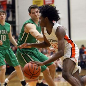 Whitney Young’s D.J. Steward (21) drives past York’s Nicholas Kosich (3) in their 58-56 win in Hillside, Wednesday, March 6, 2019. | Kevin Tanaka/For the Sun Times