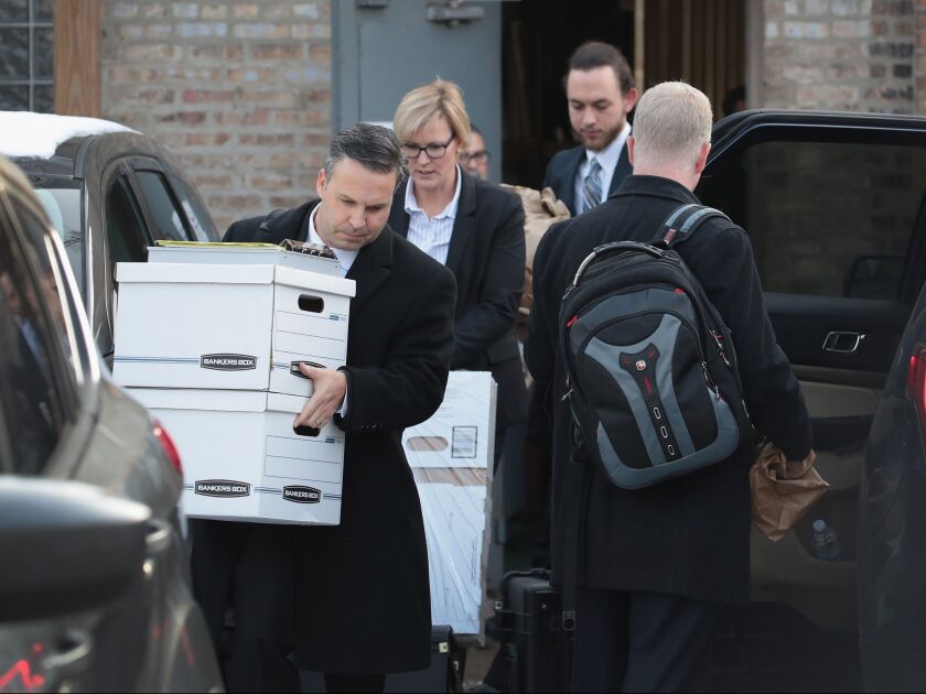 Federal agents remove computer equipment and document boxes from the Southwest Side office of Ald. Ed Burke on Nov. 29. | Scott Olson/Getty Images