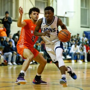 Lincoln Park’s Ismail Habib (4) moves the ball past Young’s Elliott Sieger (13).