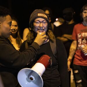 The girlfriend of Anthony Huber speaks to protesters during a peaceful march around Kenosha on the fourth day of civil unrest after police shot Jacob Blake, Wednesday night, Aug. 26, 2020. Huber, 26, of Silver Lake was one of two men shot to death during unrest Tuesday night and Kyle Rittenhouse, 17, has been charged in connection with the homicides.