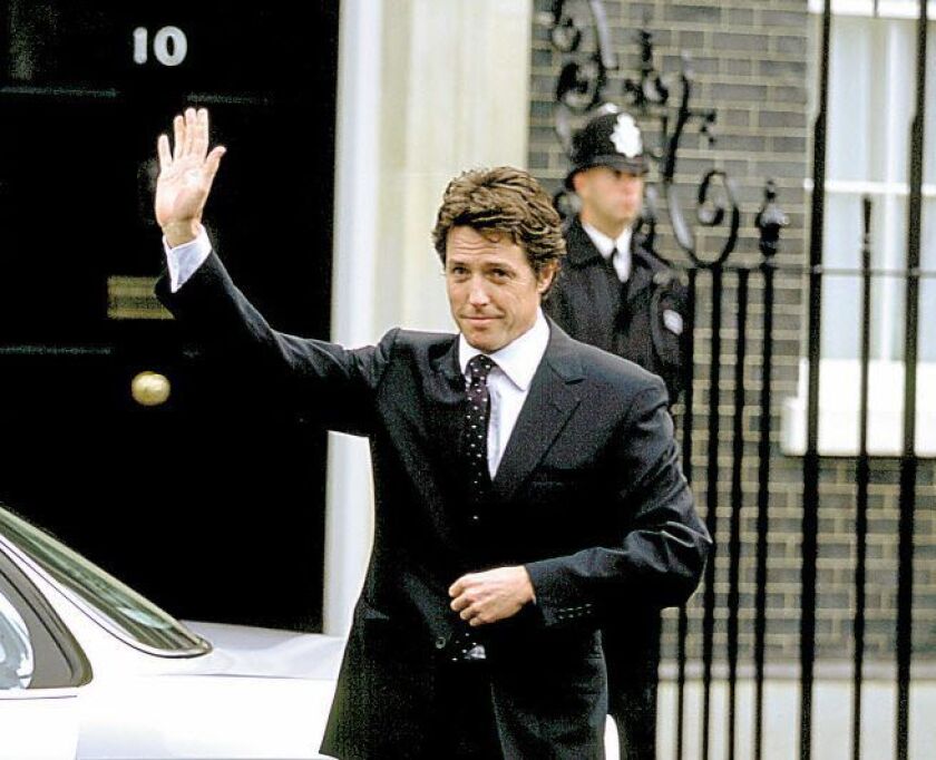 The new Prime Minister (Hugh Grant) prepares for his first day on the job in Richard Curtis’ romantic comedy “Love Actually.” | Peter Mountain/ ©2003 Universal Studios