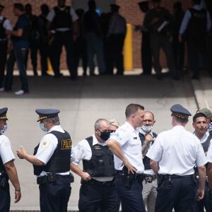 Police officers gather outside Advocate Illinois Masonic Medical Center after an officer was shot at the 25th District police station on the Northwest Side, Thursday, July 30, 2020.