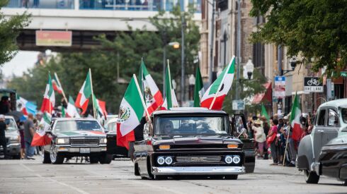 Paradegoers ride lowrider cars during the 20th annual Mexican Independence Day Parade along West 18th Street in the Pilsen neighborhood, Saturday afternoon, Sept. 10, 2022.