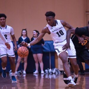 DePaul Prep’s Raheem Anthony (10) and St. Mel’s Deion Jackson (13). Worsom Robinson/For the Sun-Times.
