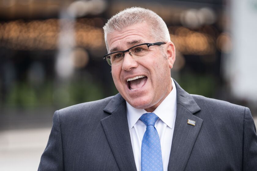 Republican gubernatorial nominee Darren Bailey talks to reporters on Tuesday.