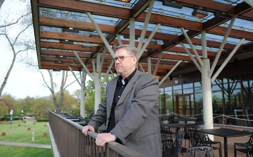 Architect Michael Barnes of Wight and Company looks out from the Tree Top Porch, a new dining area at Ravinia. Barnes designed the 2007 dining pavilion building and was commissioned to design the new incarnation for its 2018 debut. | Victor Hilitski/For t