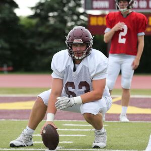 Loyola’s Josh Kreutz gets ready to snap the ball.