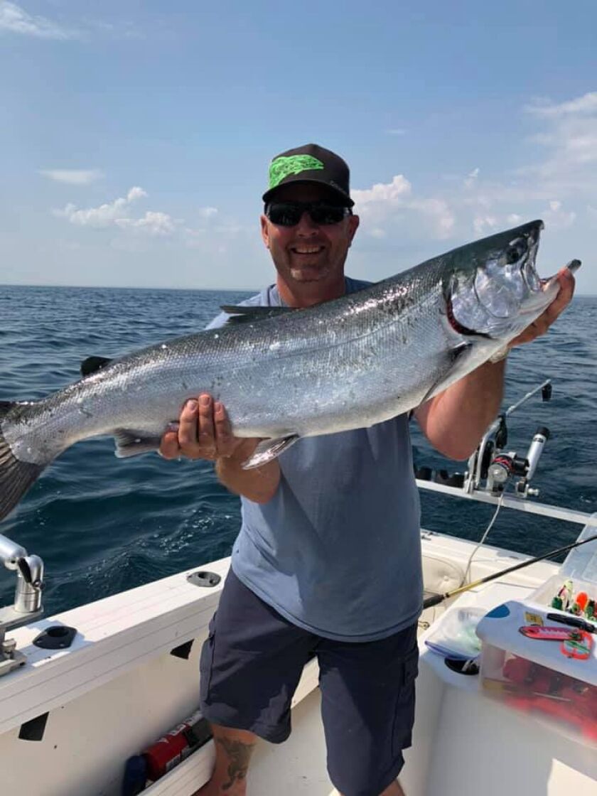 Chris Ranney holds his near-record coho caught out of Waukegan. Provided photo