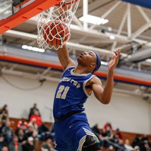 Bloom’s Dante Maddox, Jr. (21) dunks the ball against Benet.